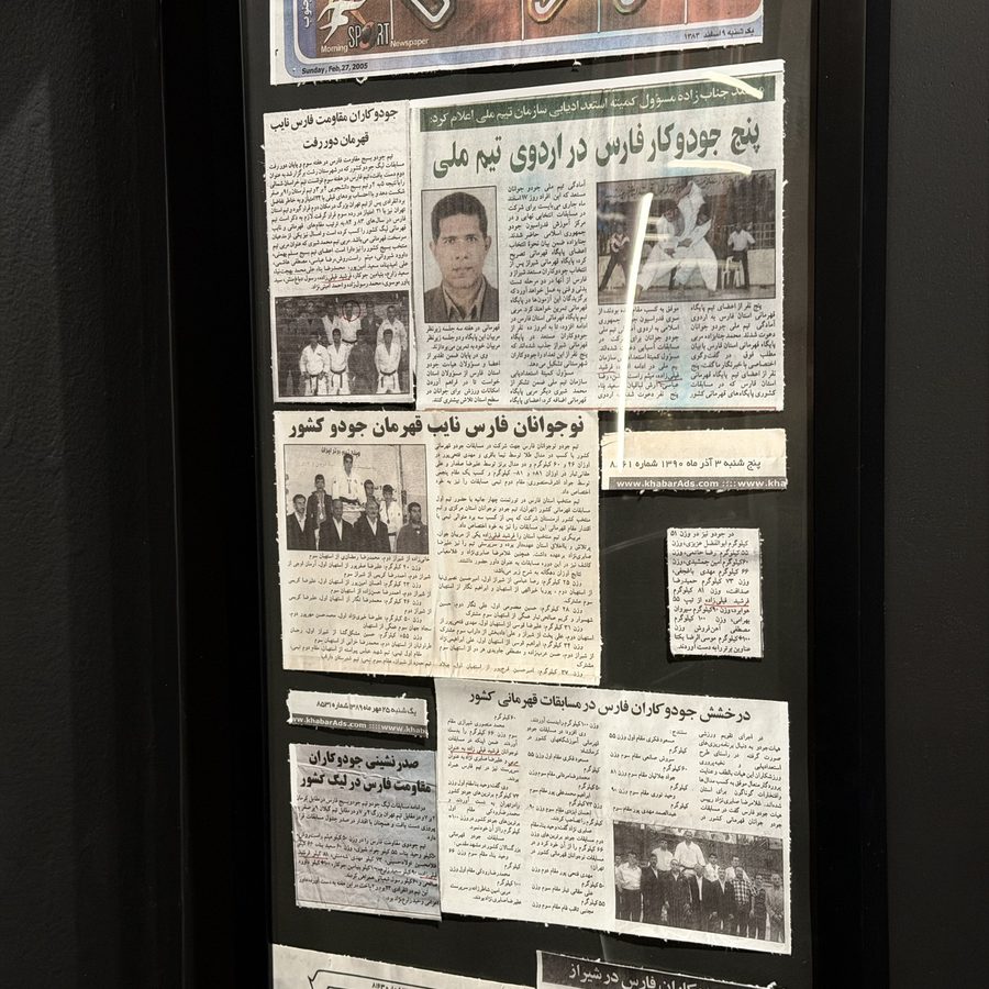 Framed newspaper coverage of judo competitions